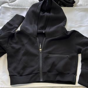 Ptula cropped hoodie in black, size medium, oversize fit